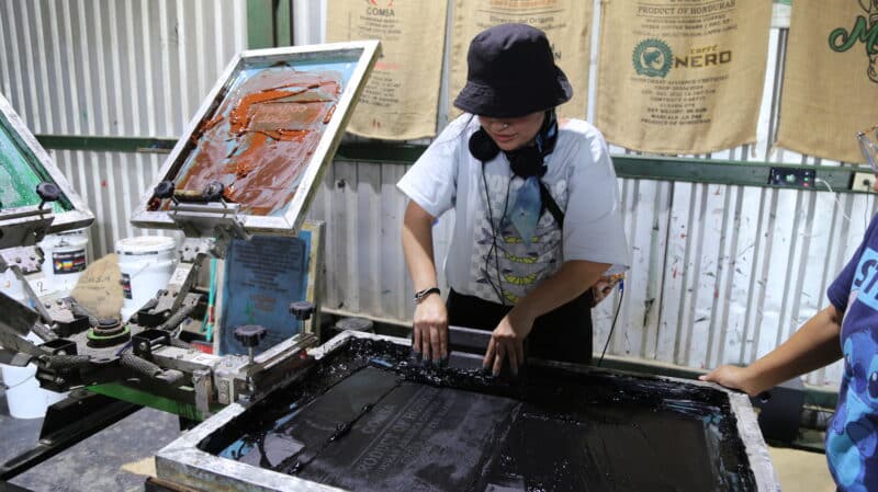 IMG_0388 Daniela stamping a coffee bag at COMSA.